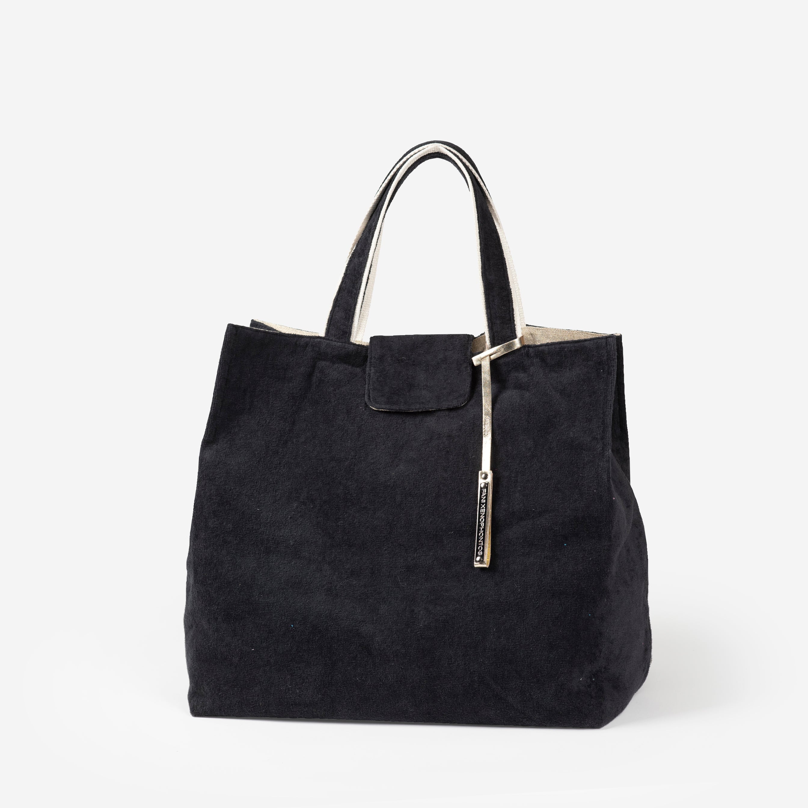 Black beach bag with a silver clasp on a white background