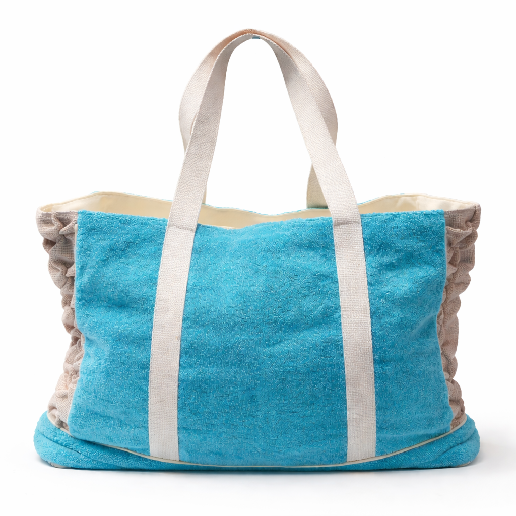 Blue towel bag with beige trim on a white background