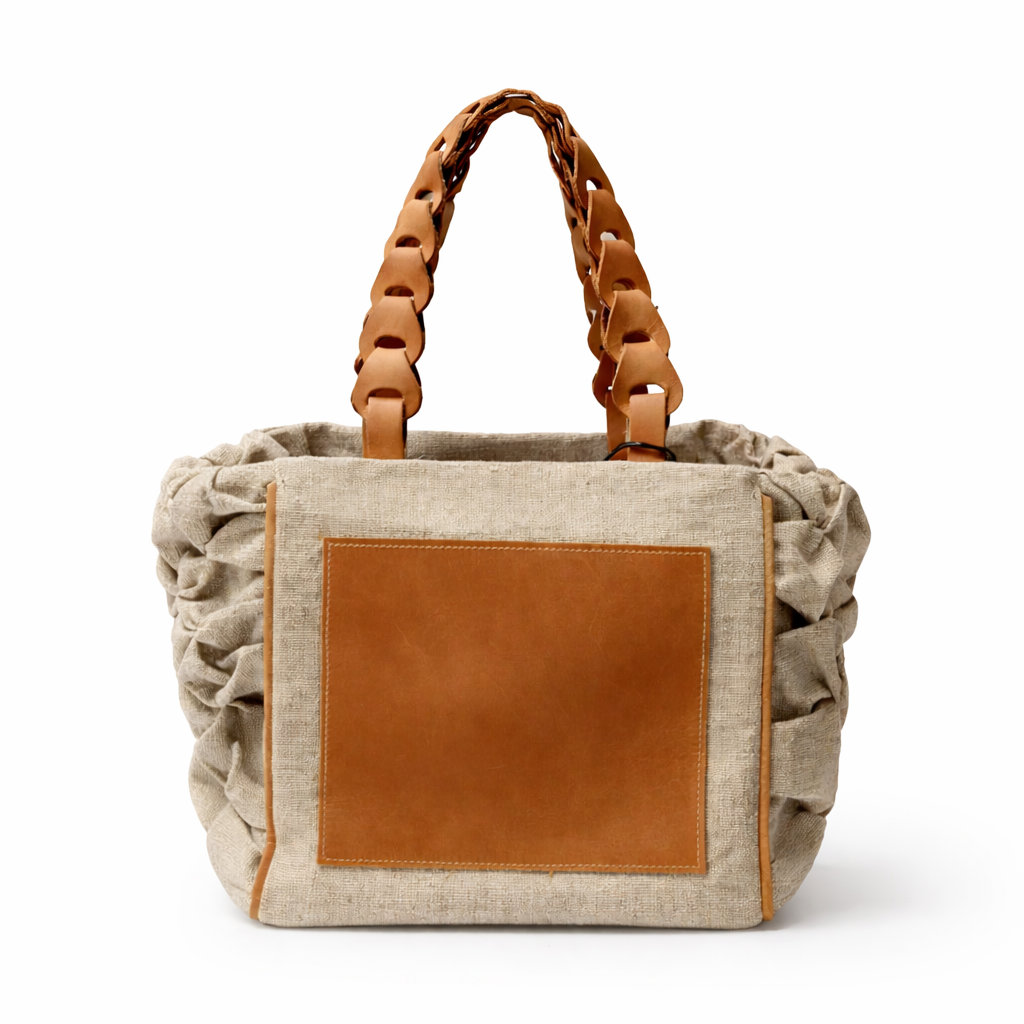 Tote Bag with brown leather patch and handle on a white background