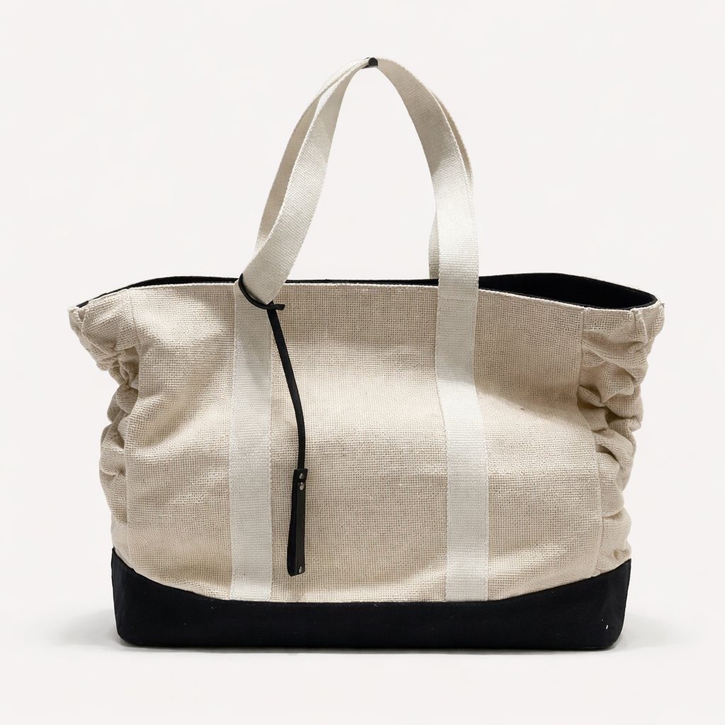 Canva tote bag with black accents on a white background